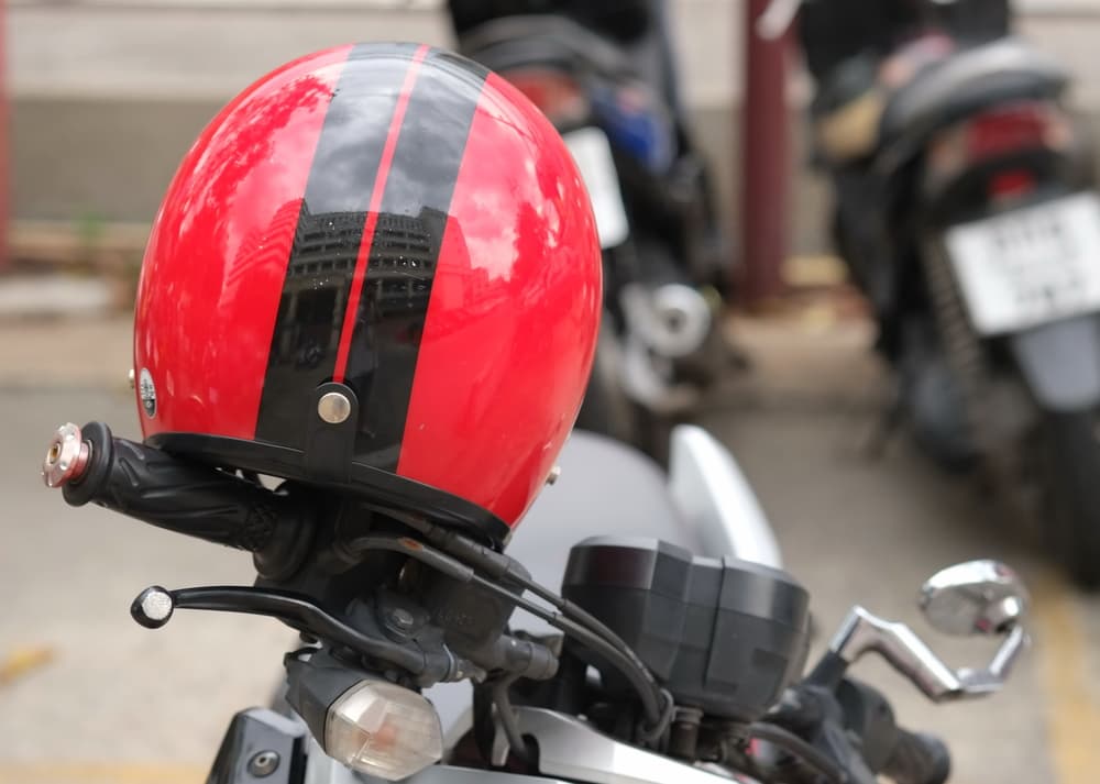 Helmet with red polish. Reflections of a hat